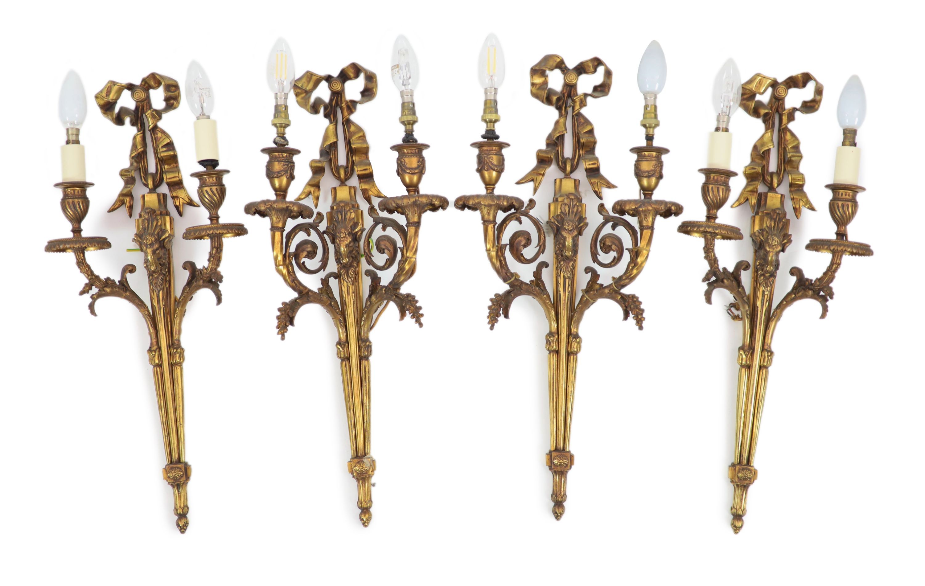 Two pairs of Adam Revival ram's mask head motif wall lights H 59cm. W 29cm. & H 59cm. W 23cm.